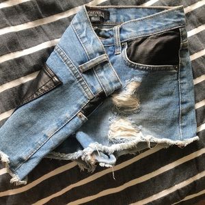 Half black leather shorts